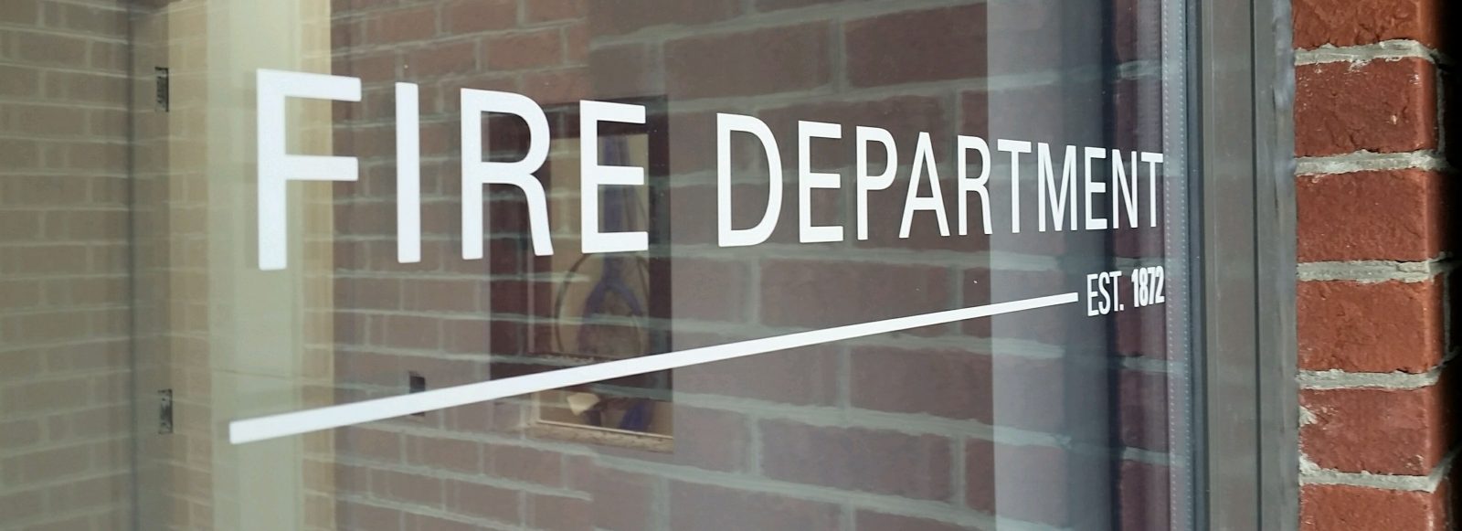 Name decals on glass foor of Shelby Fire Department